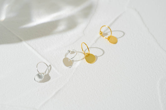 Gold and Silver Disc Charm Huggie Hoop Earrings Gold and Silver Disc Charm Huggie Hoop Earrings
