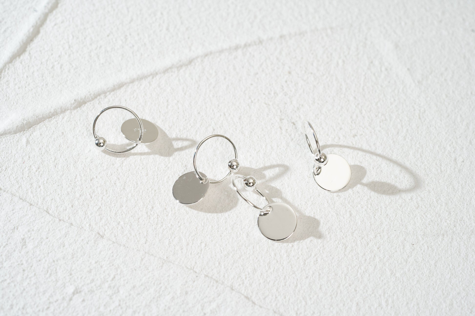 Gold and Silver Disc Charm Huggie Hoop Earrings Gold and Silver Disc Charm Huggie Hoop Earrings