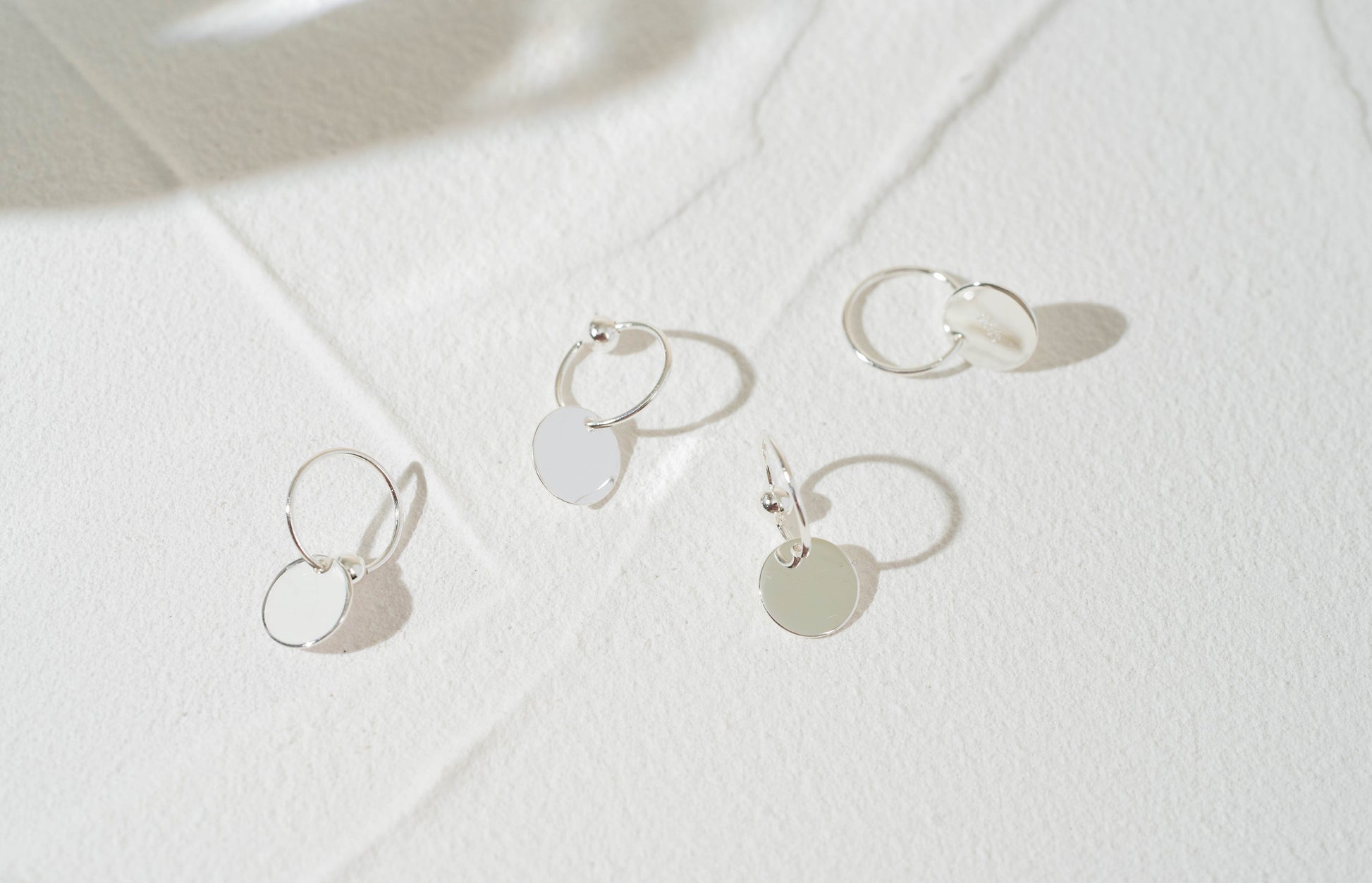 Gold and Silver Disc Charm Huggie Hoop Earrings Gold and Silver Disc Charm Huggie Hoop Earrings