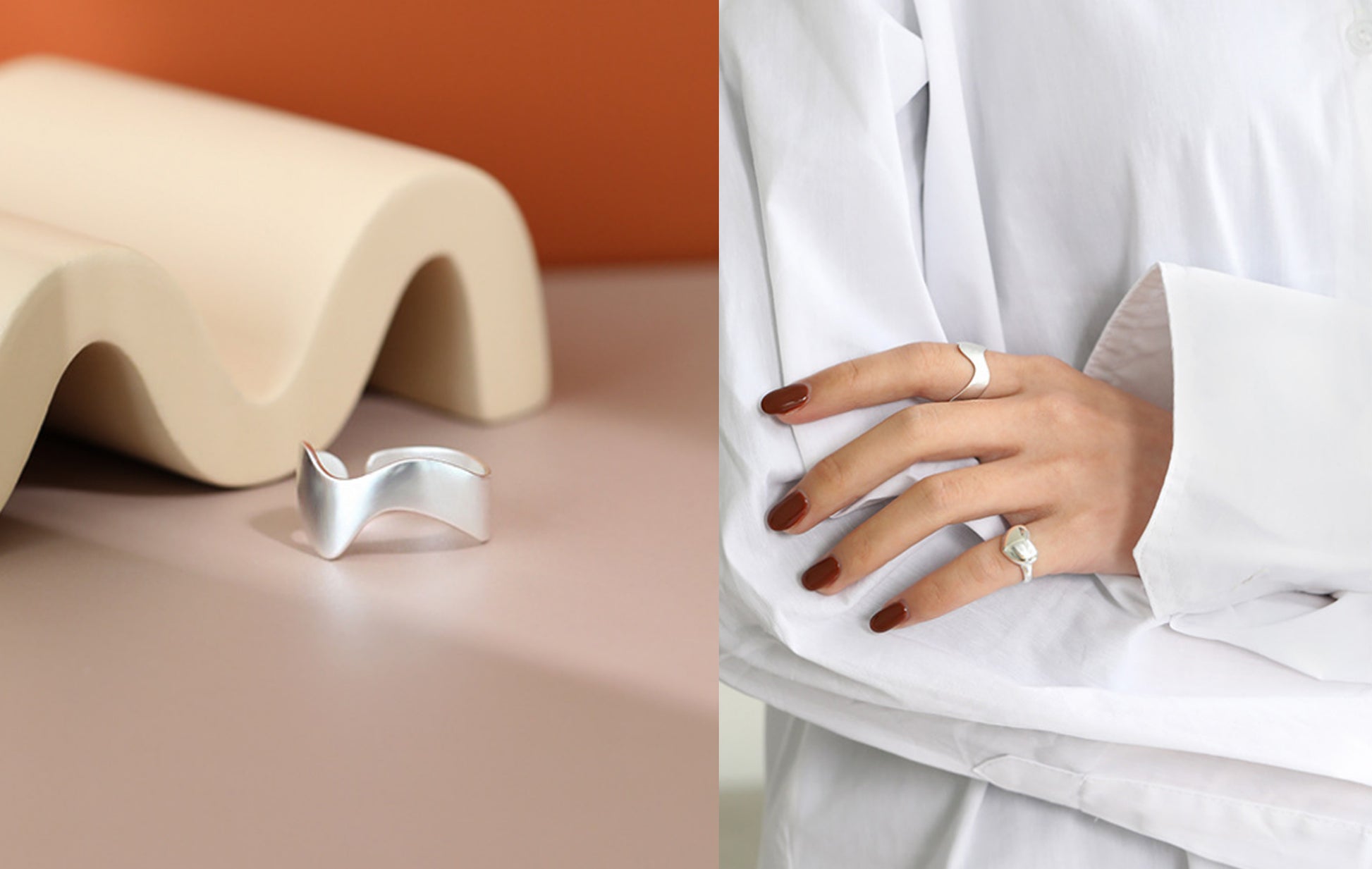 Silver ring on a beige surface and worn on a finger with a white outfit.