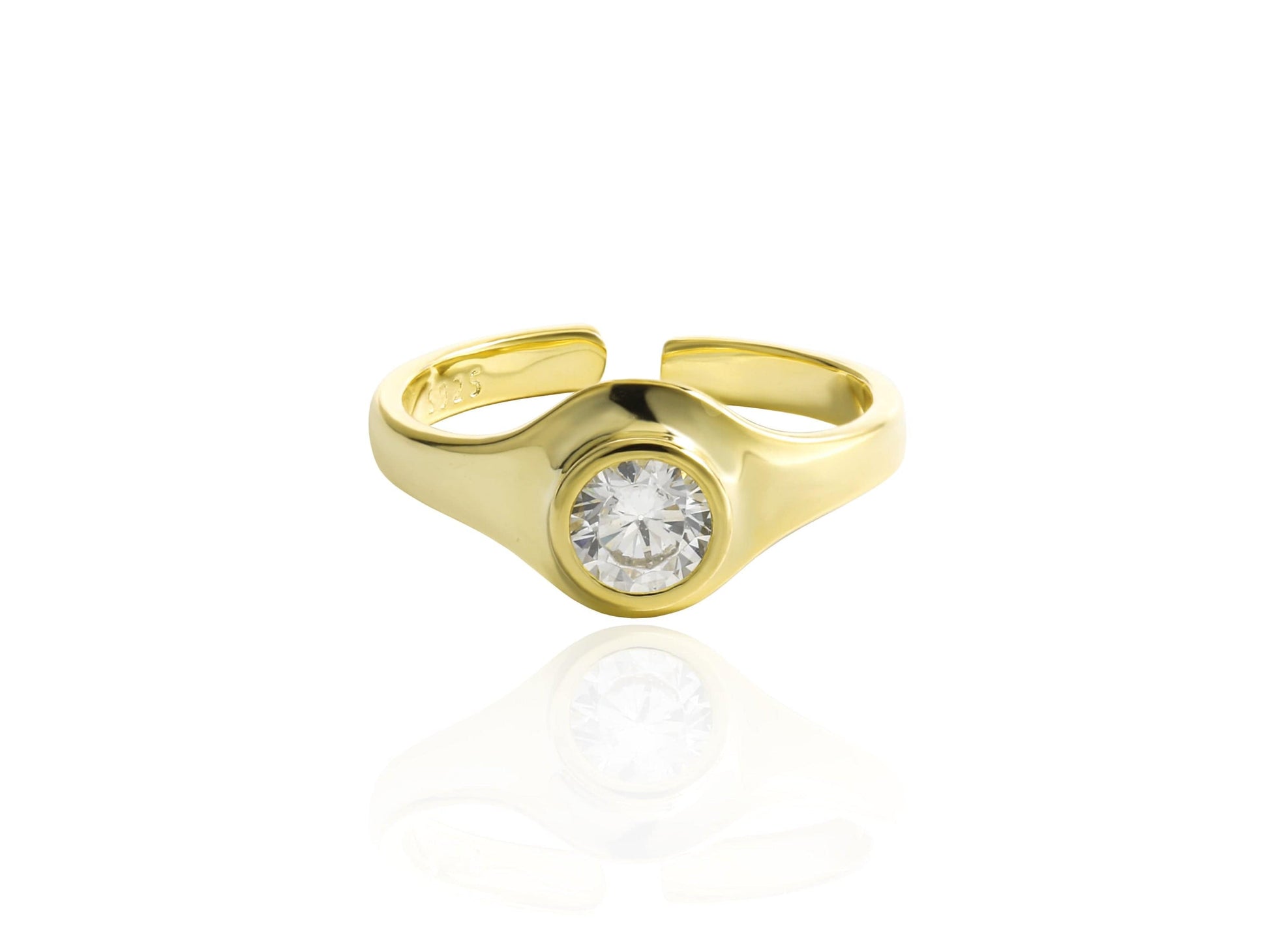 Gold ring with a diamond on a white background