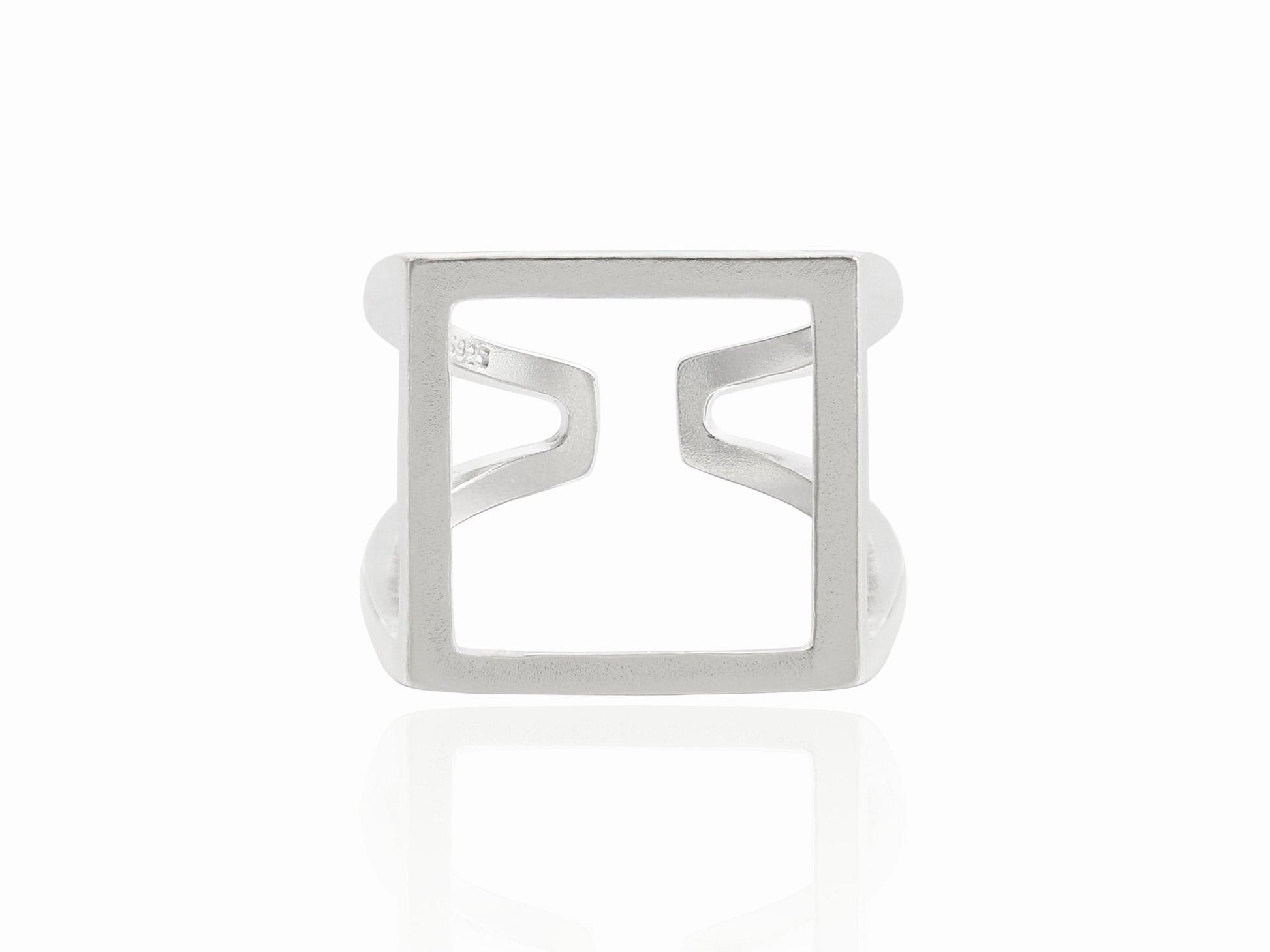 Silver ring with a square design on a white background