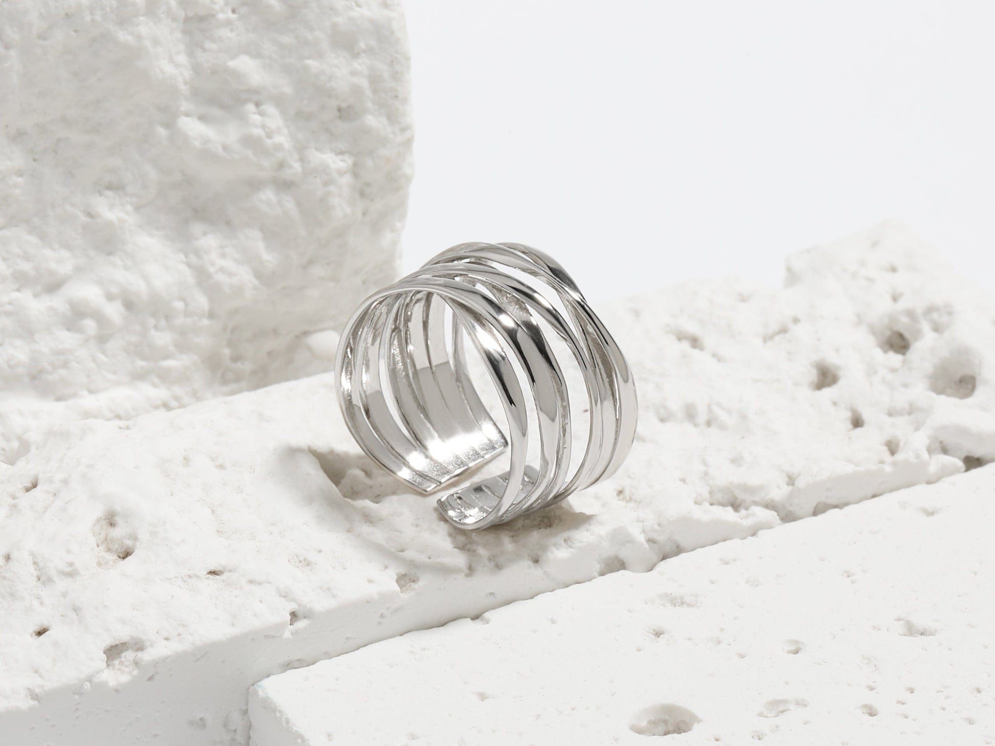 Silver ring on a textured white surface