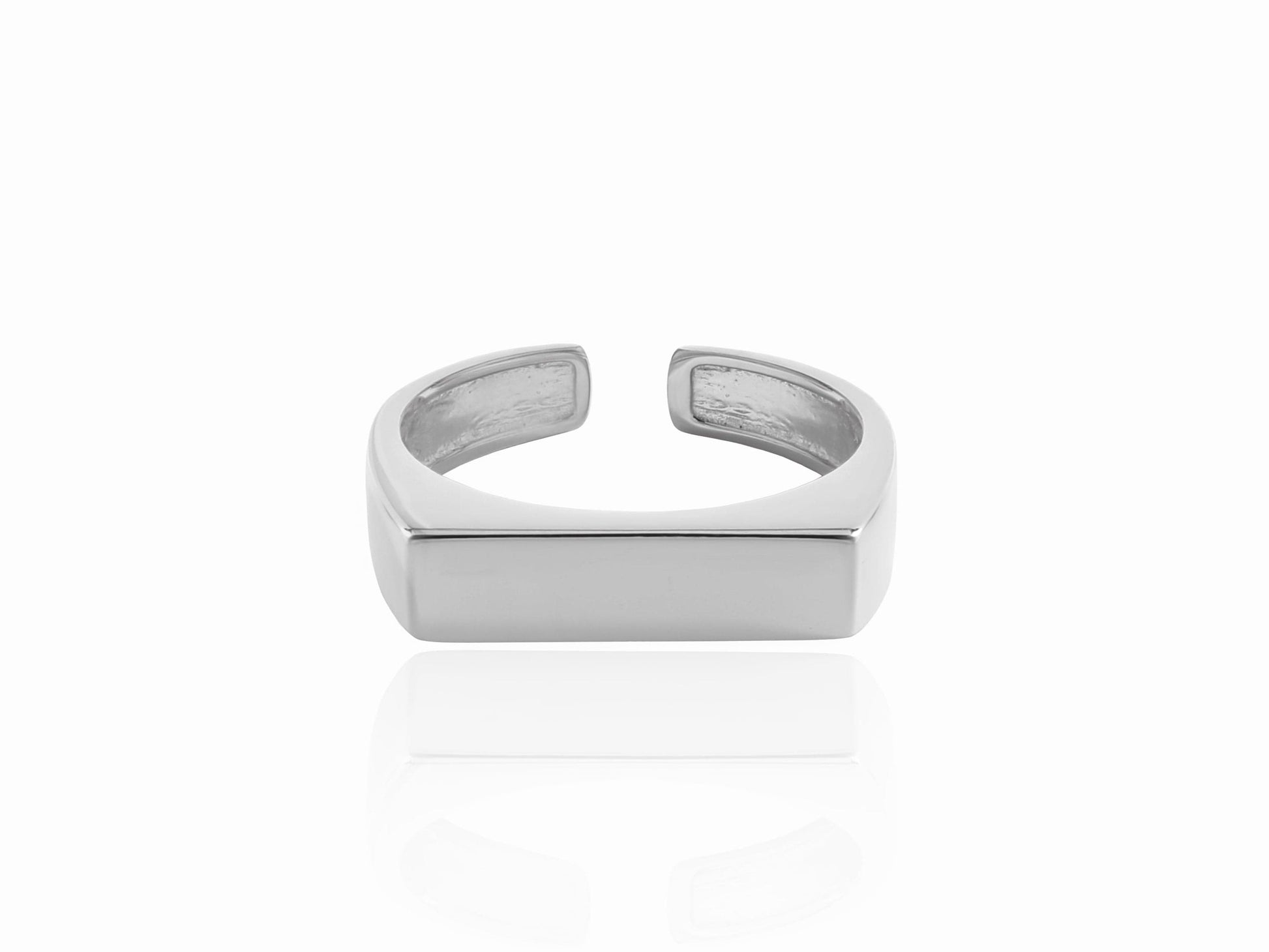 Silver open-topped ring on a white background