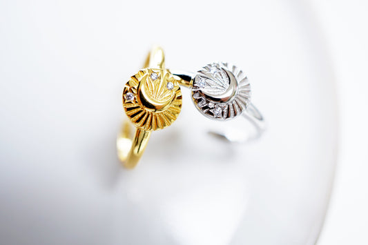 Gold and silver rings with diamond accents on a white background