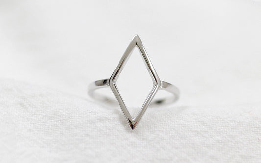 Silver geometric ring on a white background