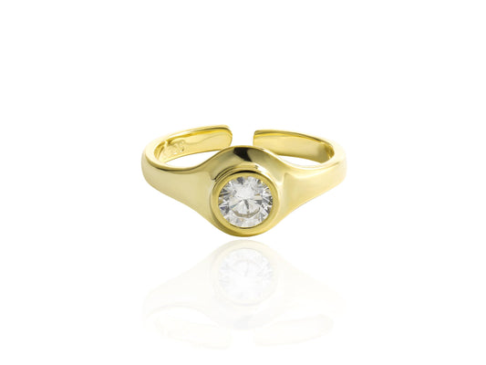 Gold ring with a diamond on a white background